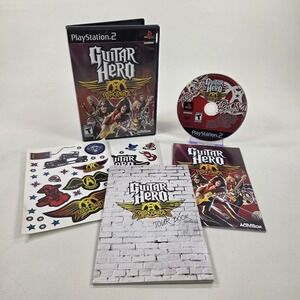 Guitar Hero Aerosmith Sony PS2 w/ Tour Book + Manual + Stickers - Tested